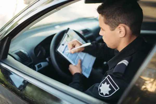 police man writing ticket